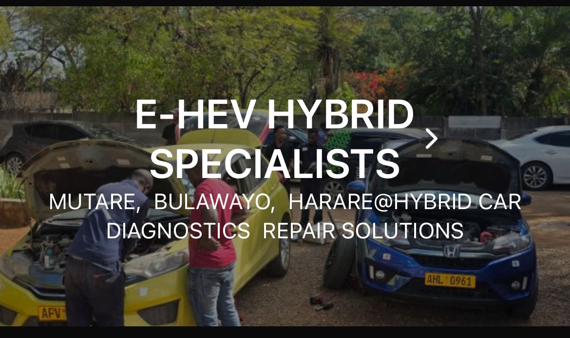 E-HEV technicians working on hybrid vehicles in the workshop yard